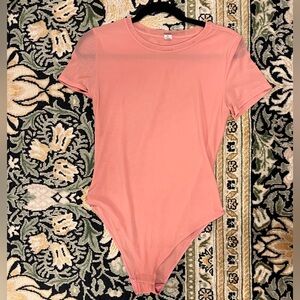 Parade short sleeve sheer pink body suit Size M